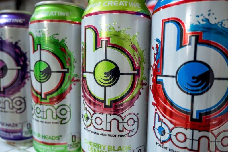 Four cans of Bang energy drink, against a white background