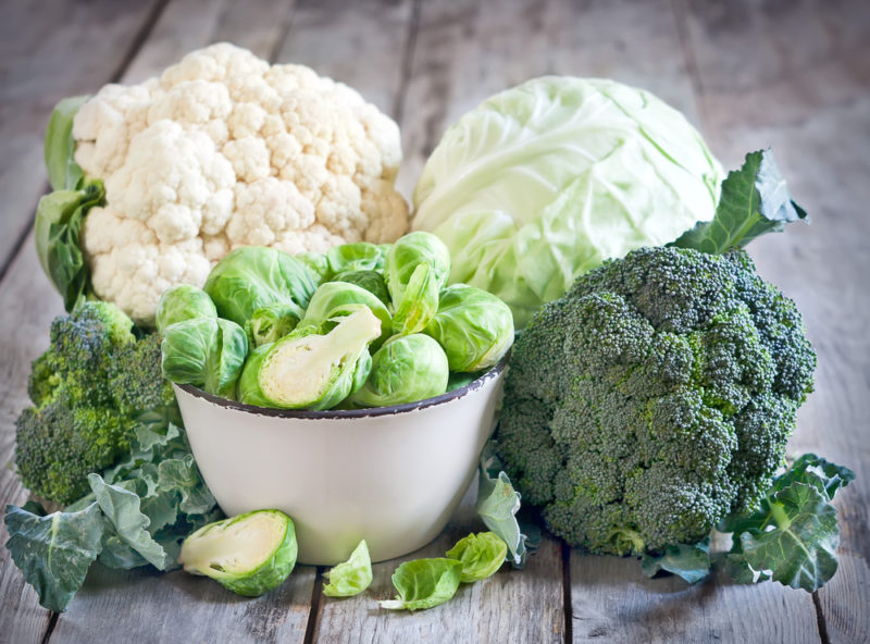 A selection of cruciferous vegetables, including cauliflower, broccoli, and brussels sprouts