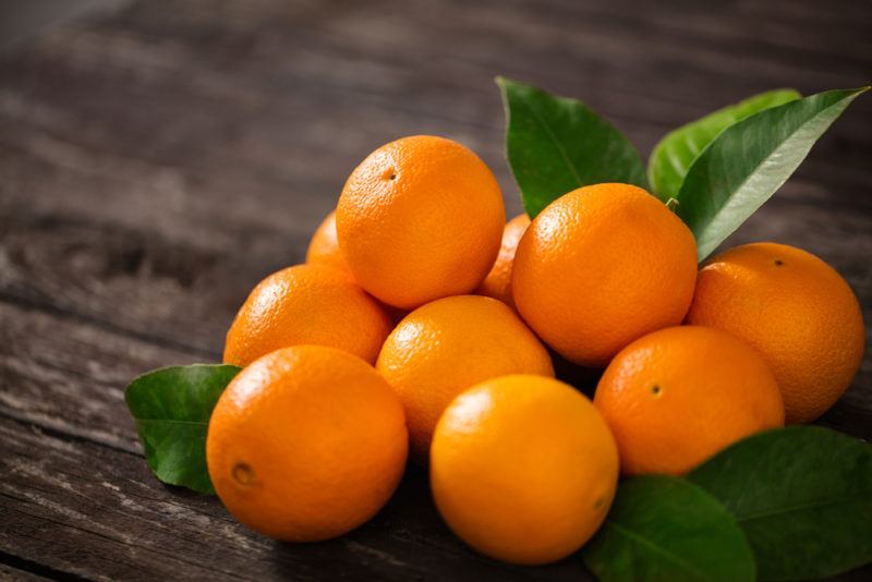 Various fresh oranges on a table