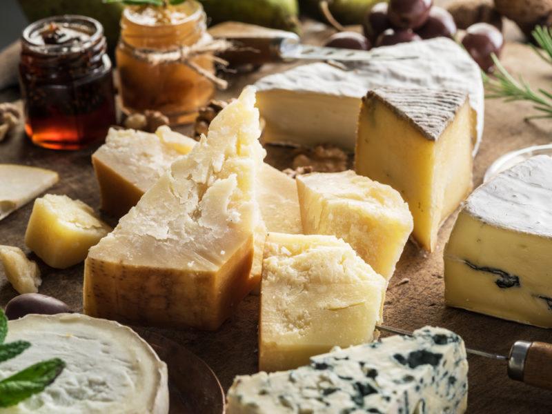 A selection of hard cheeses on a table