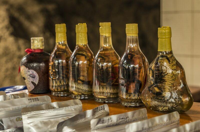 A selection of rice wine in Vietnam that includes snakes in the bottles