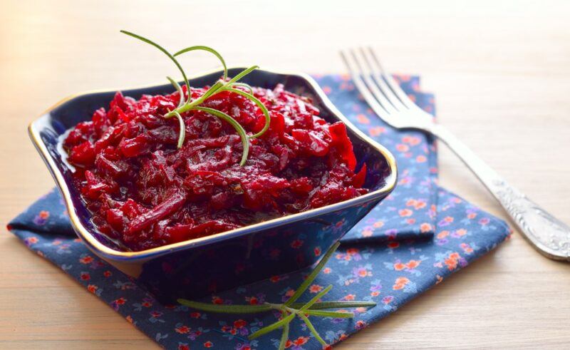 A square bowl filled of pickled beets