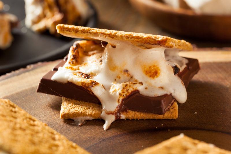 A smore for making a smores and smoke cocktail, with crackers, chocolate, and melted marshmallow