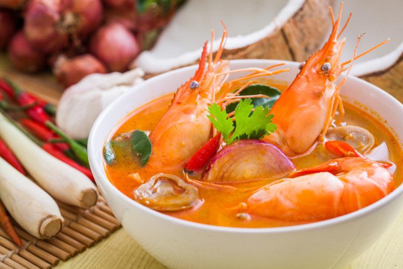 A white bowl of tom yum goong