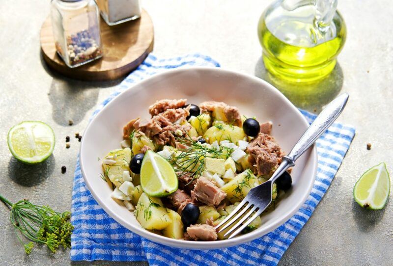 A bowl of salad with tuna