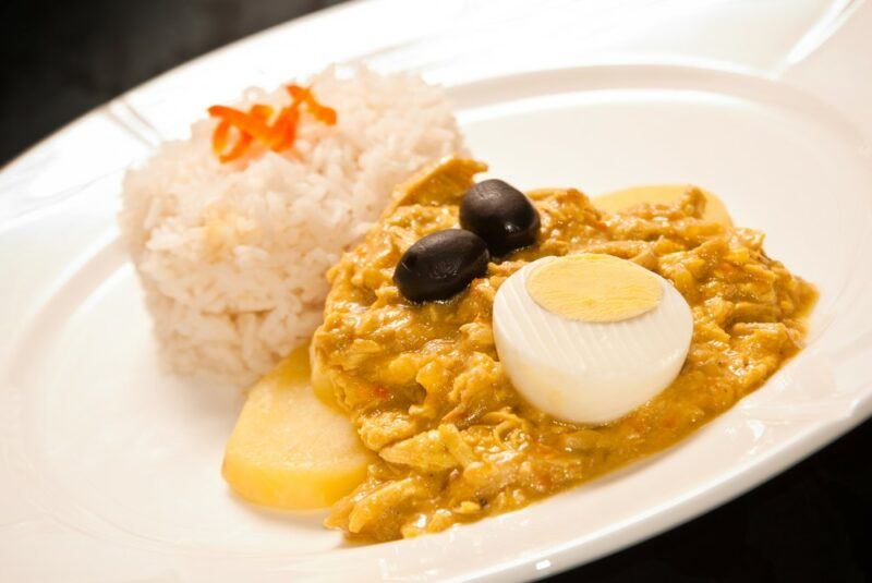 A white dish containing aji de gallina