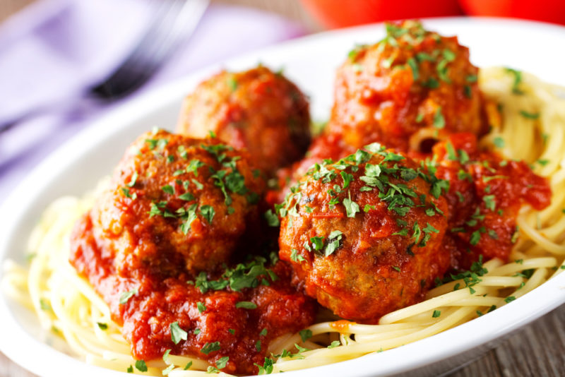 A white dish of meatballs and spaghetti | Food For Net A white dish of meatballs on cooked spaghetti