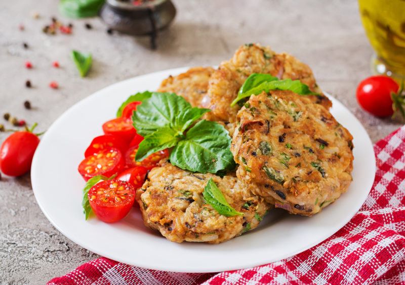 A white plate with homemade vegan burger patties