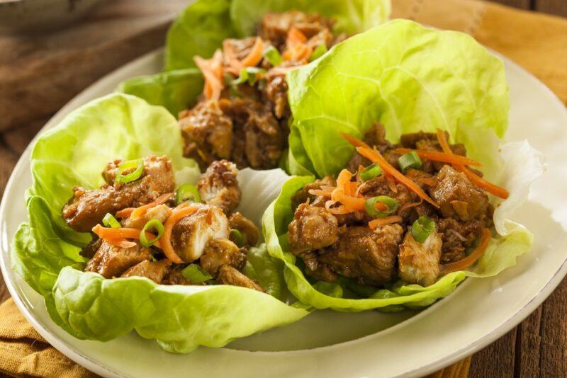 A plate with fresh chicken keto fajitas that have been made using lettuce rather than wraps