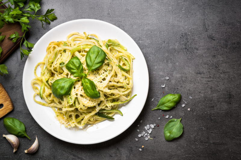 A white plate with cooked pasta and pesto | Food For Net A white plate with fresh pasta and pesto