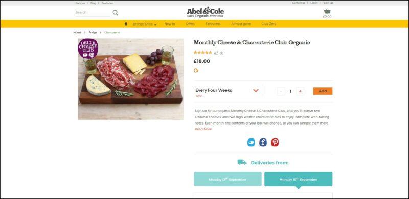 screenshot of Abel & Cole Monthly Cheese & Charcuterie Club's web page, dominantly white page with the website's name on top, followed by a yellow banner with the main menu, the page displays the details of the subscription plan accompanied by an image of a spread of cheese and charcuterie.