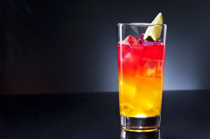 A acapulco cocktail with yellow and red tones