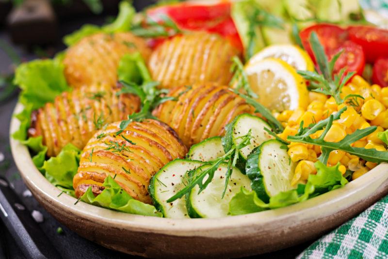 A bowl with potatoes and greens