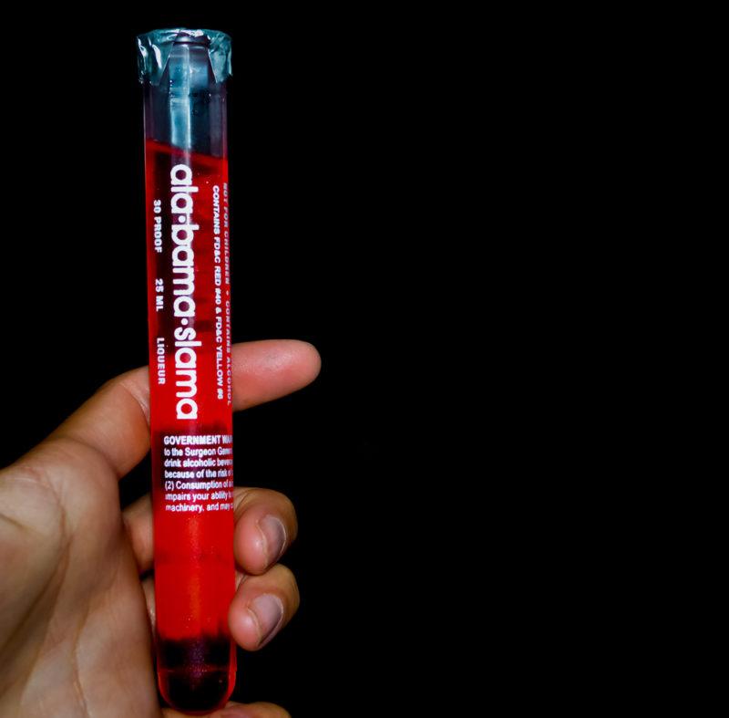 A test tube with an Alabama slammer cocktail