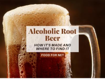 A large mug of alcoholic root beer where some of the froth is flowing over the side