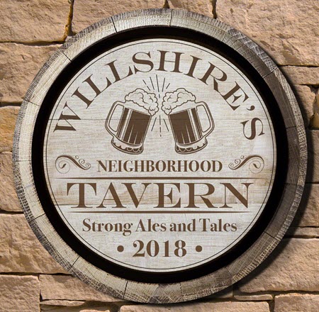 Handmade tavern sign on the lid of an old barrel