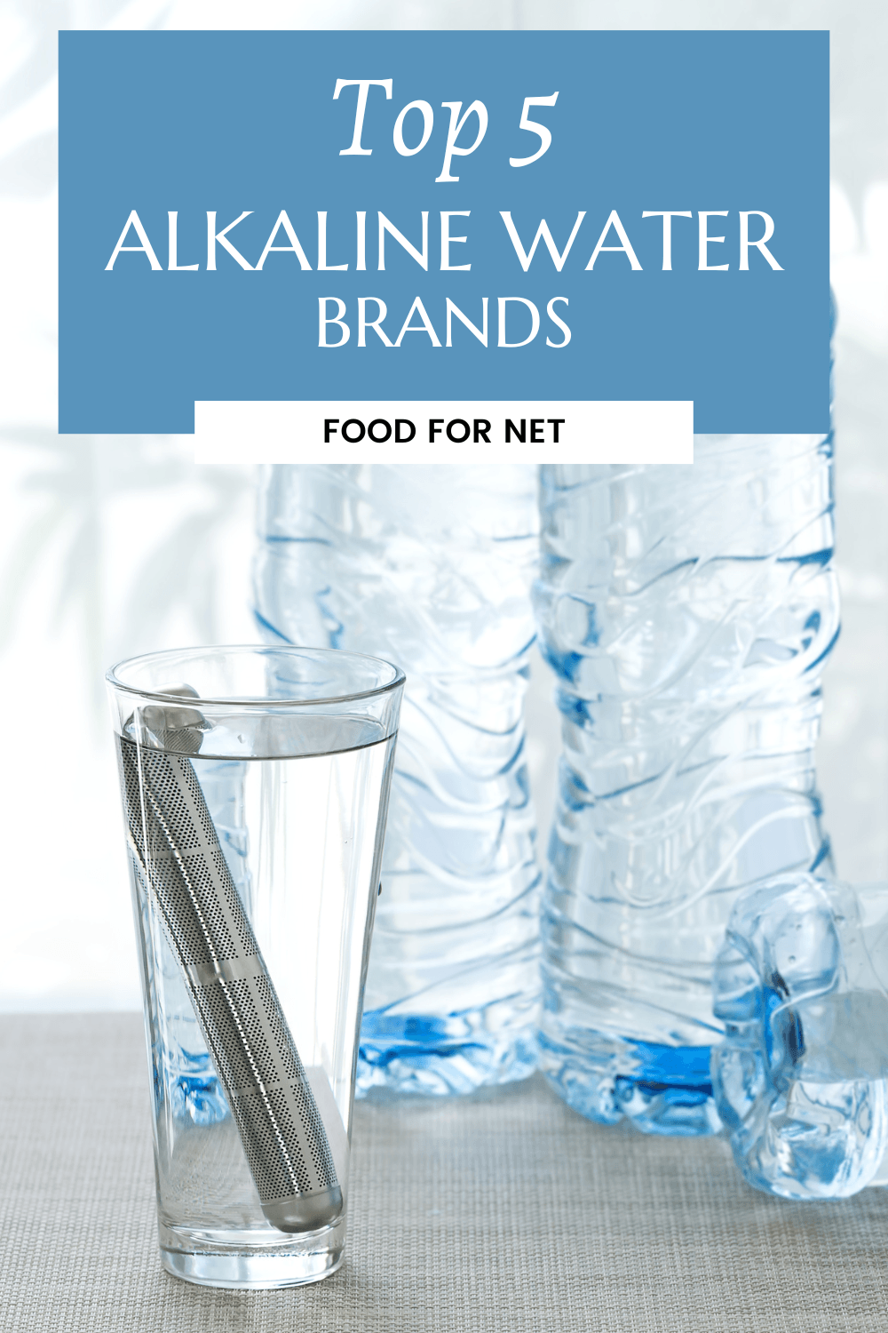 A few bottles of water, next to a glass with an alkaline water filter in it, highlighting some of the best alkaline water brands