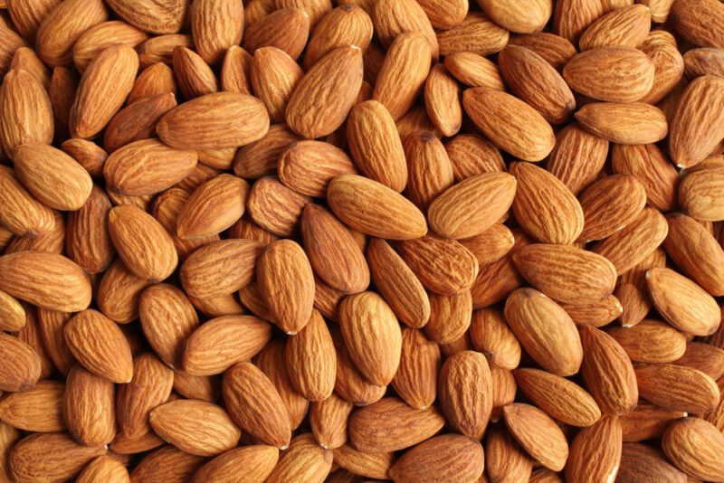 This photo shows an overhead view of several shelled almonds.