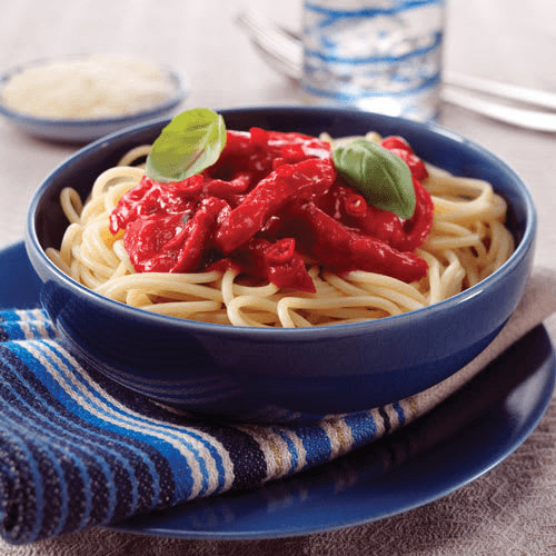 A blue bowl of cooked pasta with red sauce on top from Amazing Clubs