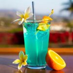 A bright blue tropical drink on a table, called adios motherfucker or AMF