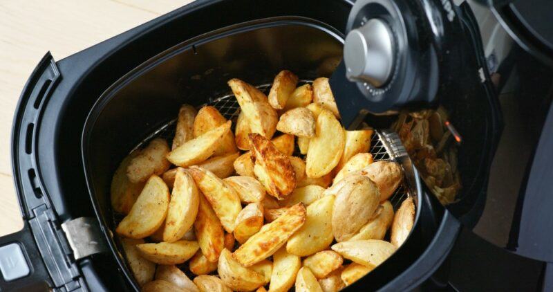 An air fryer that contains potato fries or wedges