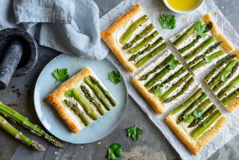 A selection of asparagus and ricotta tarts for a picnic