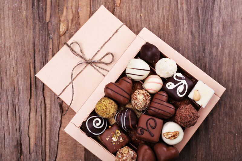 An expensive box of chocolates on a wooden table