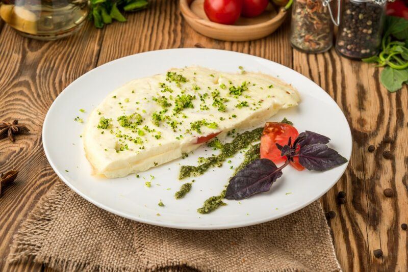 A white plate with an egg white omelet