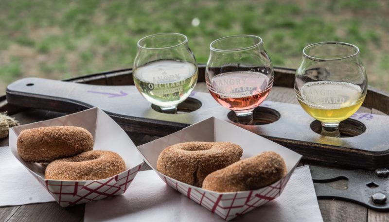 angry orchard cider flight tasting with apple cider donuts