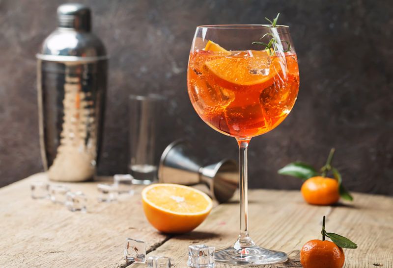 A large glass containing an aperol spritz