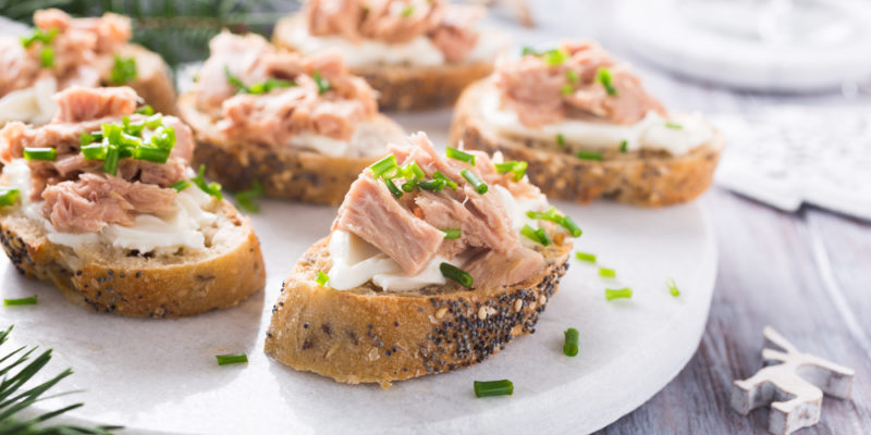 Appetizers with tuna on a white plate