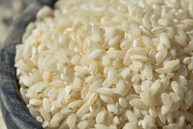 closeup image of Arborio rice in a stone bowl