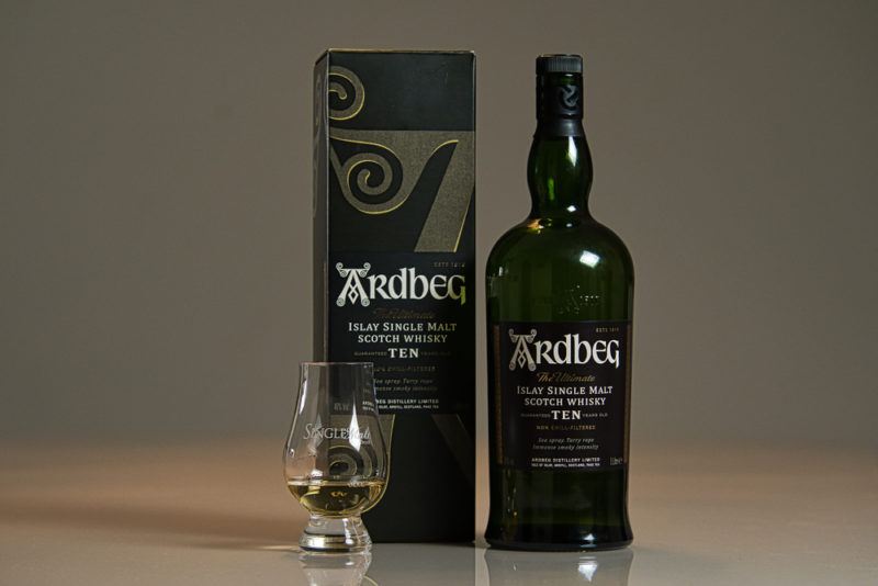 Ardbeg 10 bottle, box, and whisky snifter glass