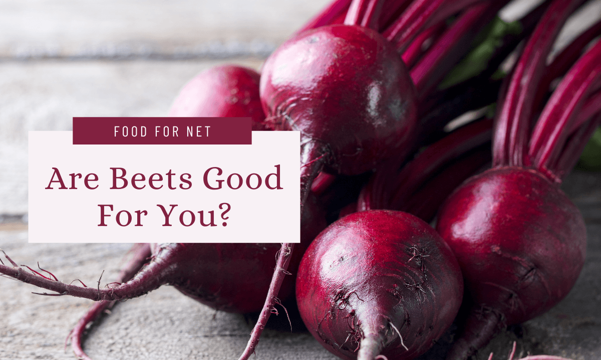 Fresh beets with their stalks on a table, highlighting the question of whether beets are good for you