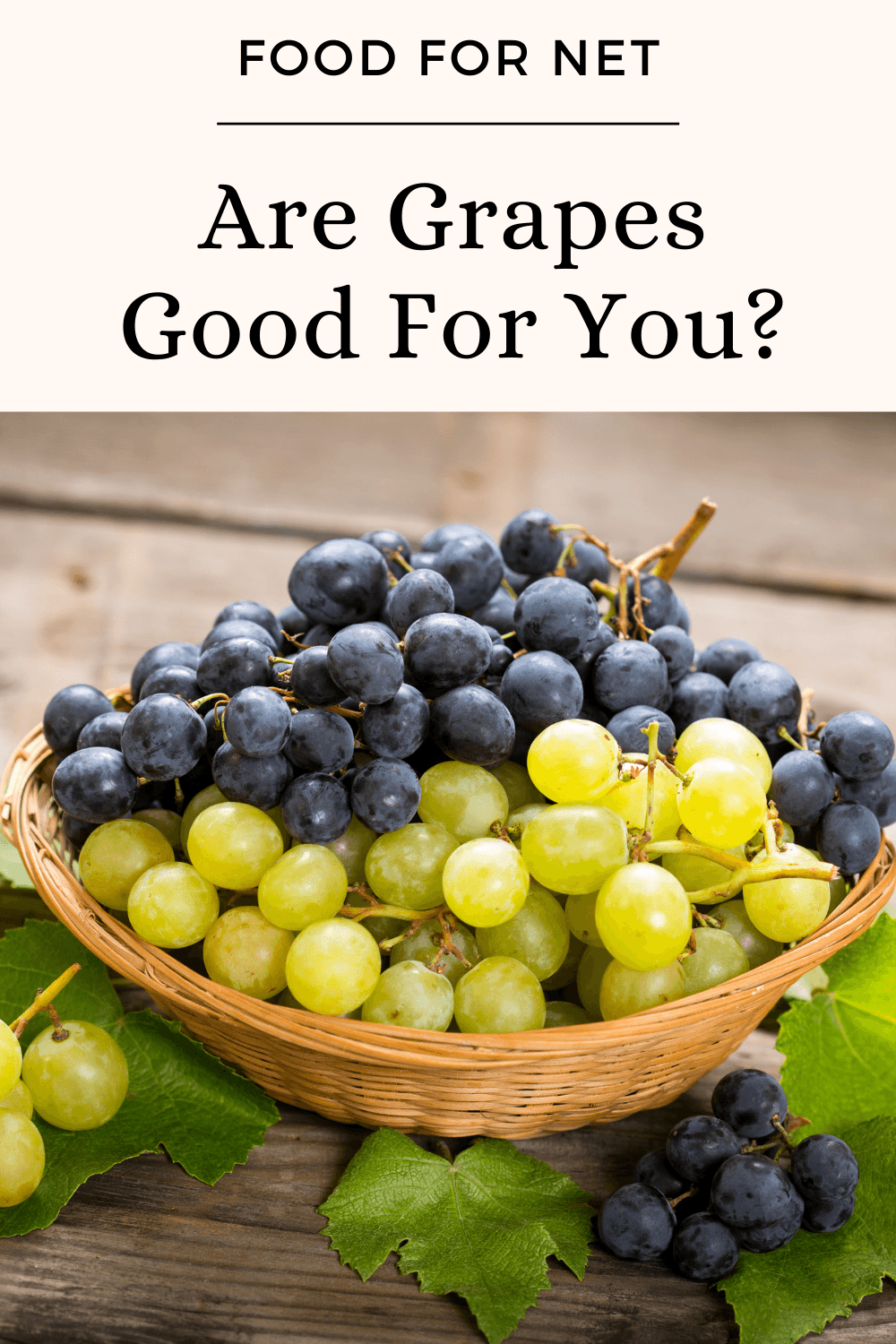 A light brown basket of black and green grapes, looking at whether grapes are good for you