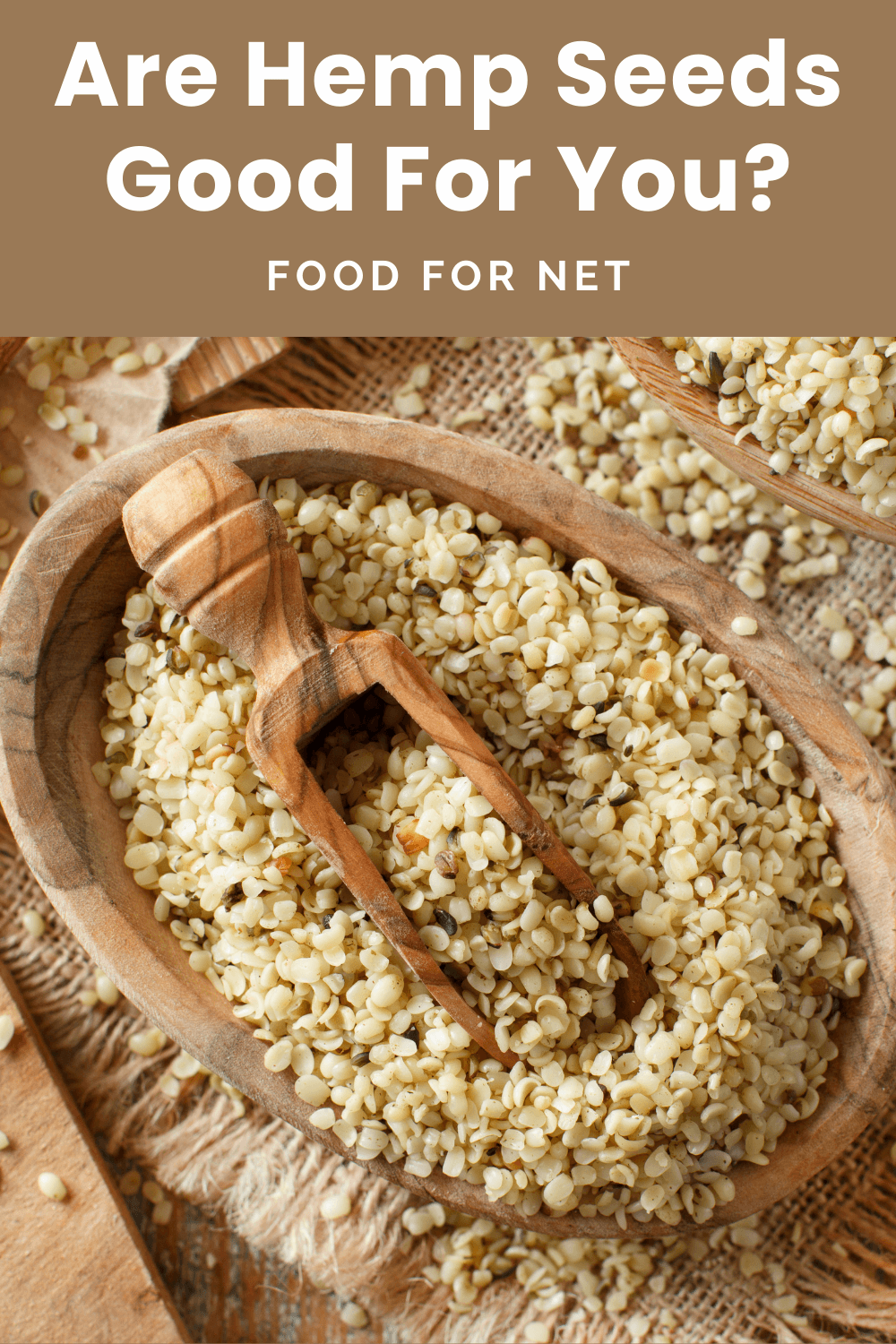 A large brown bowl of hemp hearts, with a wooden scoop in the middle, looking at whether hemp seeds are good for you