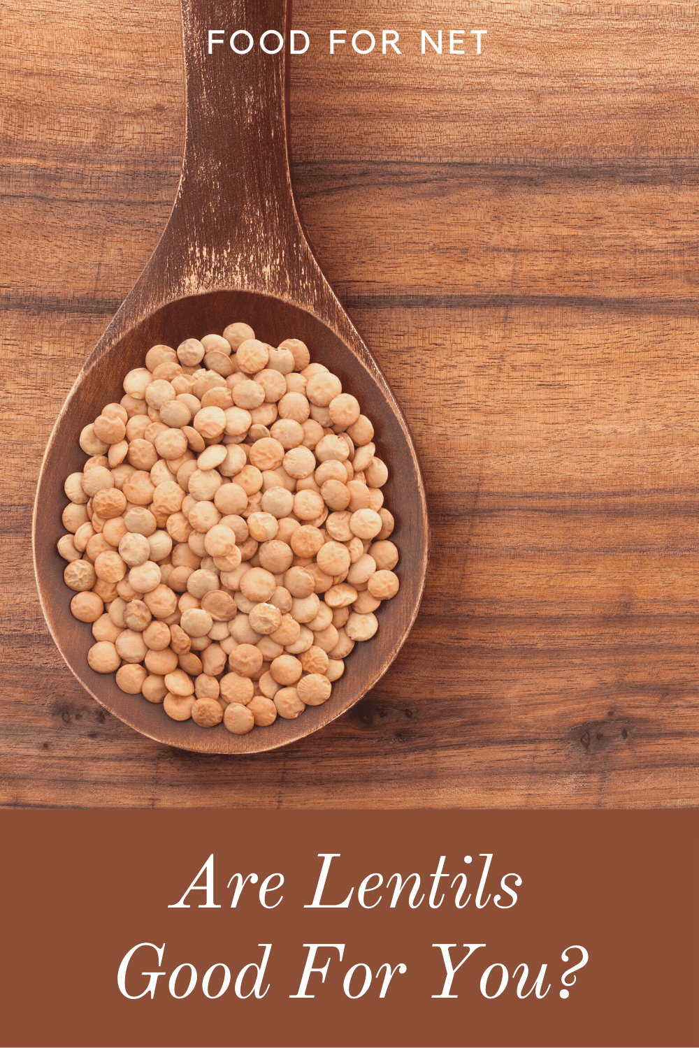 Are Lentils Good For You? A single wooden spoon filled with lentils on a wooden table