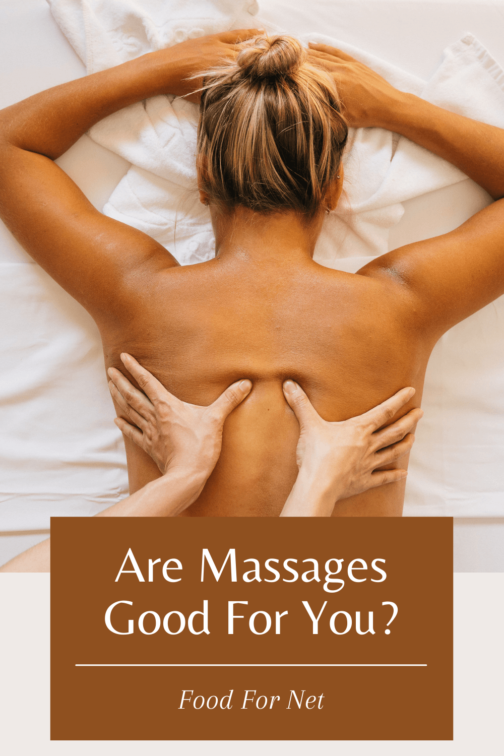 Are Massages Good For You? A woman lying flat on a sheet, having her back massaged, looking at whether massages are good for you