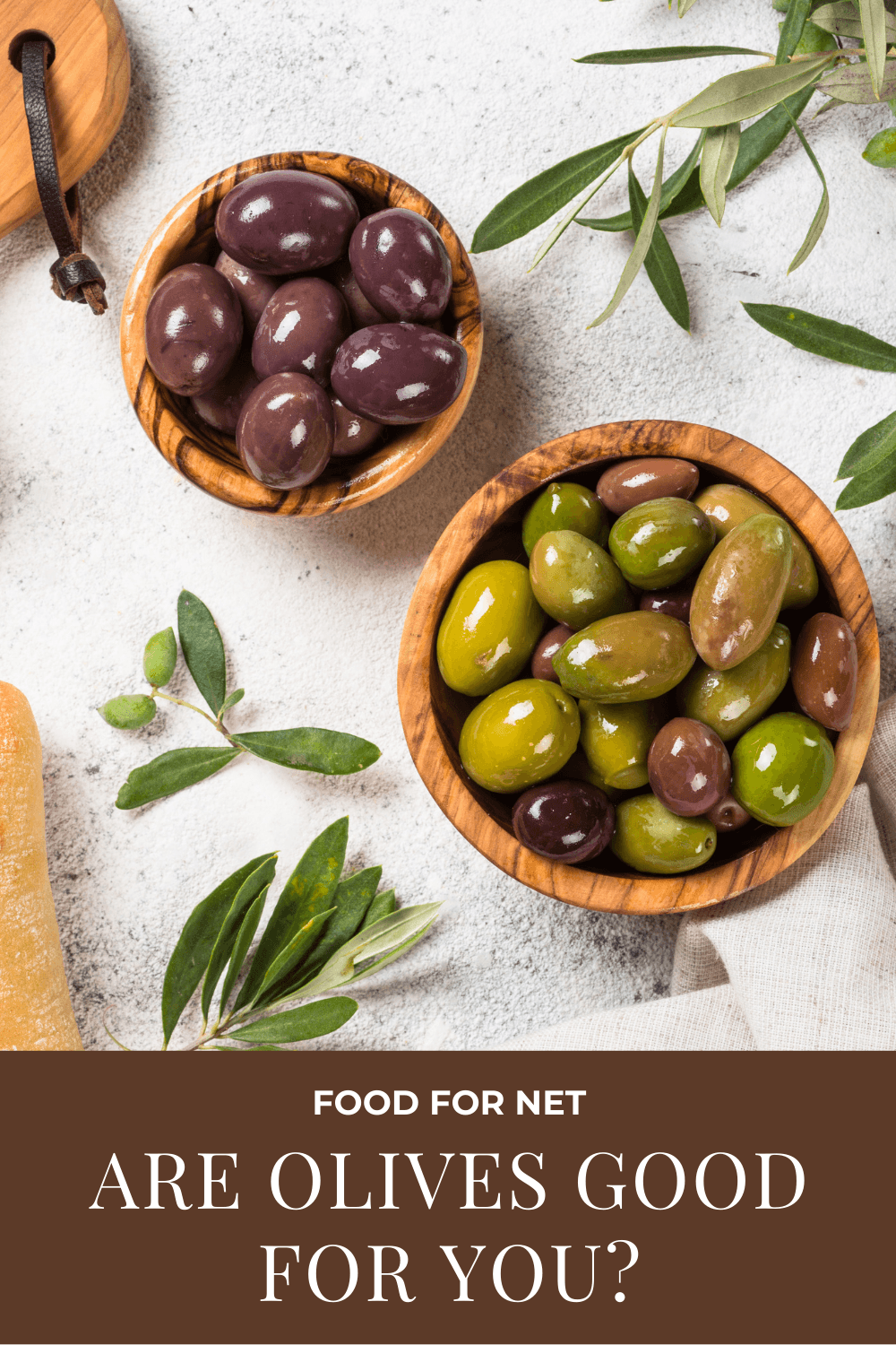 A bowl of black olives and one with green ones, highlighting the idea of whether olives are good for you