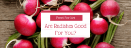 A selection of pink red radishes with green stalks on a table, looking at whether radishes are good for you
