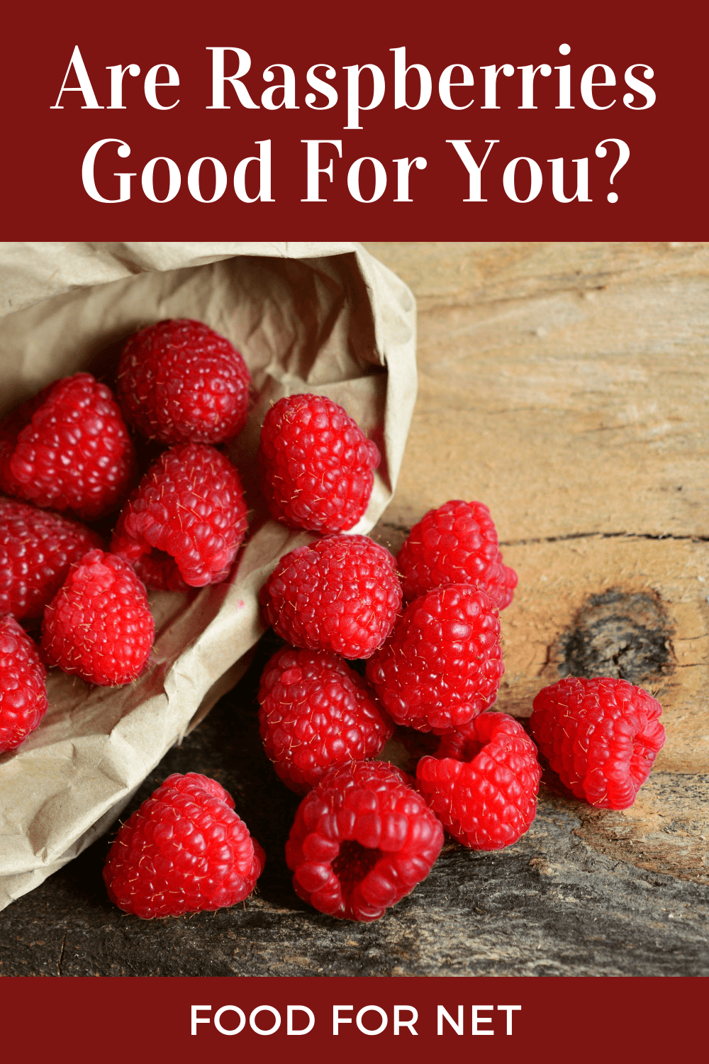 Are Raspberries Good For You? A paper bag filled with raspberries, with some more spilling onto the table