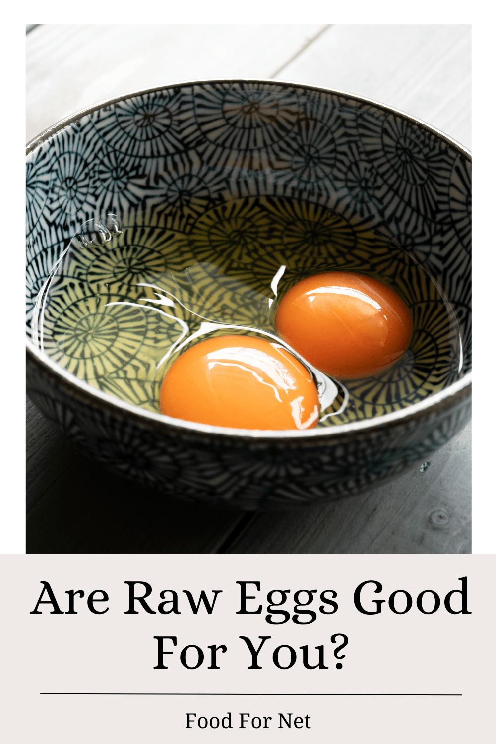 A black and white bowl with two raw eggs, looking at whether raw eggs are good for you