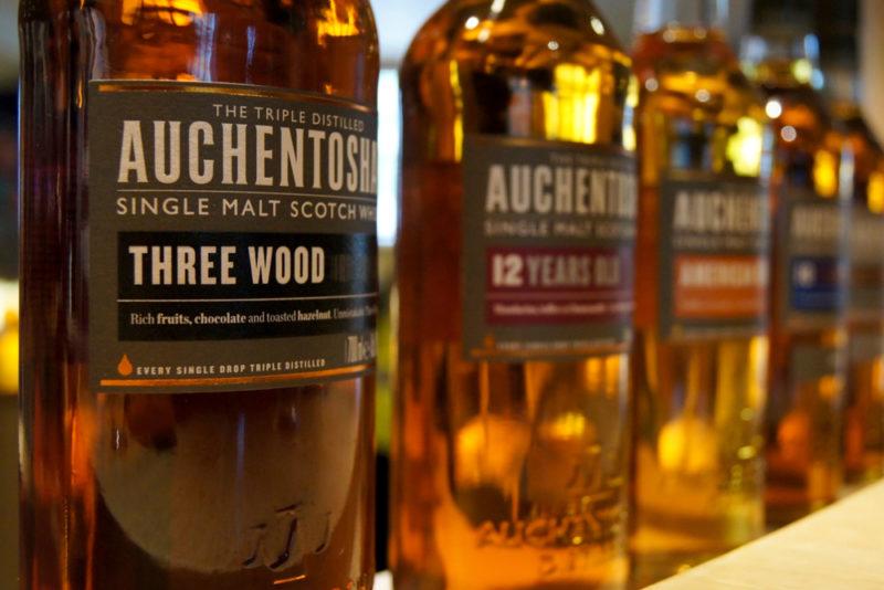 Auchentoshan single malt Scotch whisky bottles on a shelf