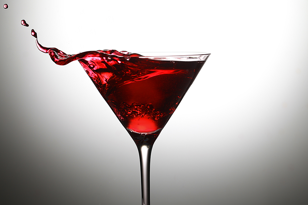 An Aunt Roberta cocktail in a martini glass against a white lit background