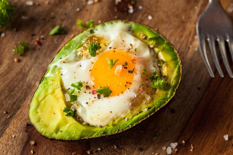 A baked avocado with an egg