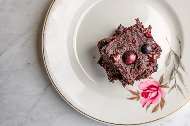 A stack of avocado fudge on a white plate with a floral pattern