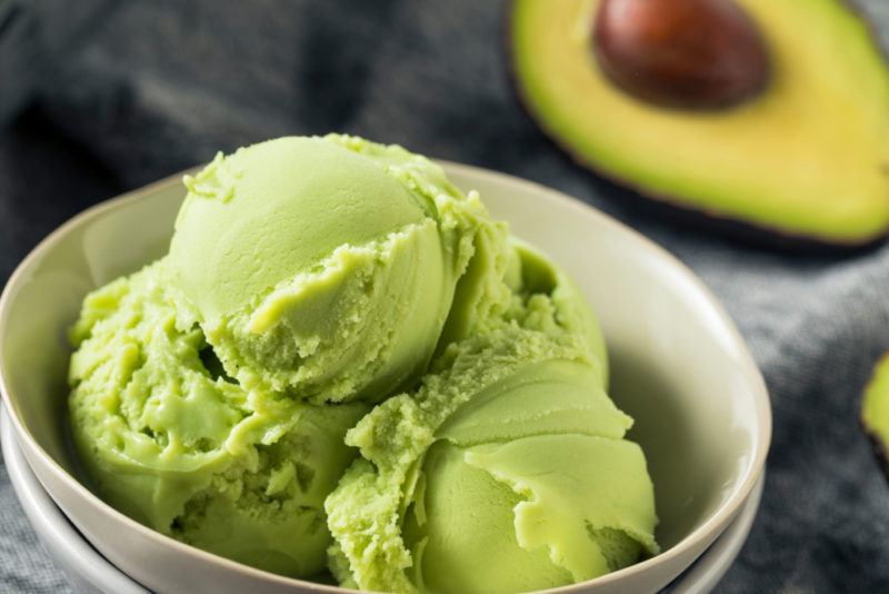 A white bowl with avocado ice cream