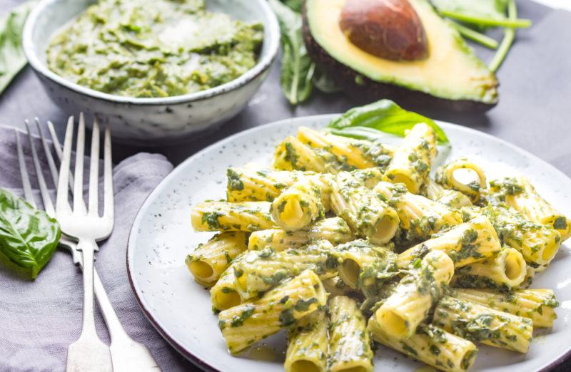 Avocado pasta on a white plate