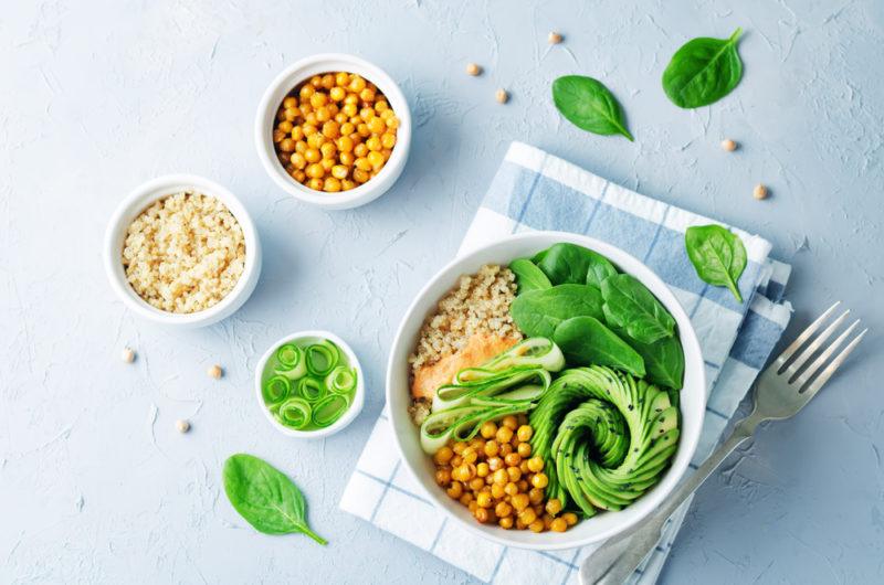 A power bowl with grains, avocado and greens