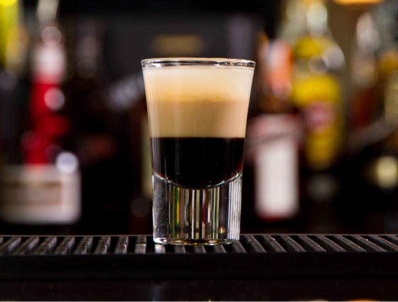 A layered B52 shot in a glass on a bar